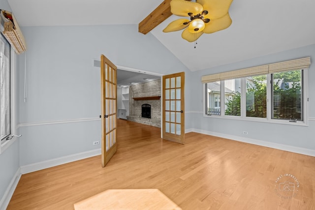 342 Dilorenzo Dr, Naperville, IL 60565 - unfurnished room featuring french doors, a fireplace, light wood-style flooring, and a ceiling fan