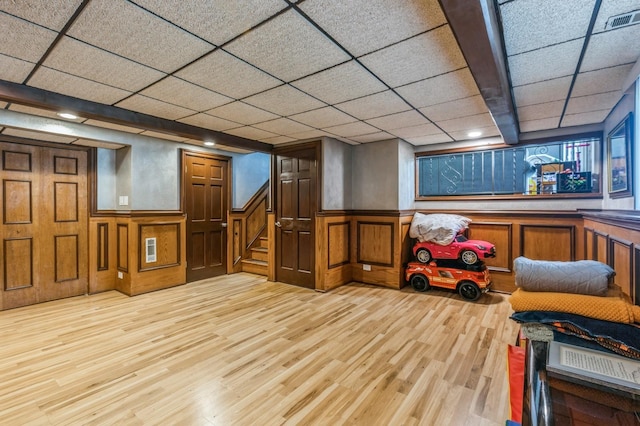 912 Macgregor Rd, Lockport, IL 60441 - finished below grade area featuring a wainscoted wall, light wood finished floors, stairway, and a paneled ceiling