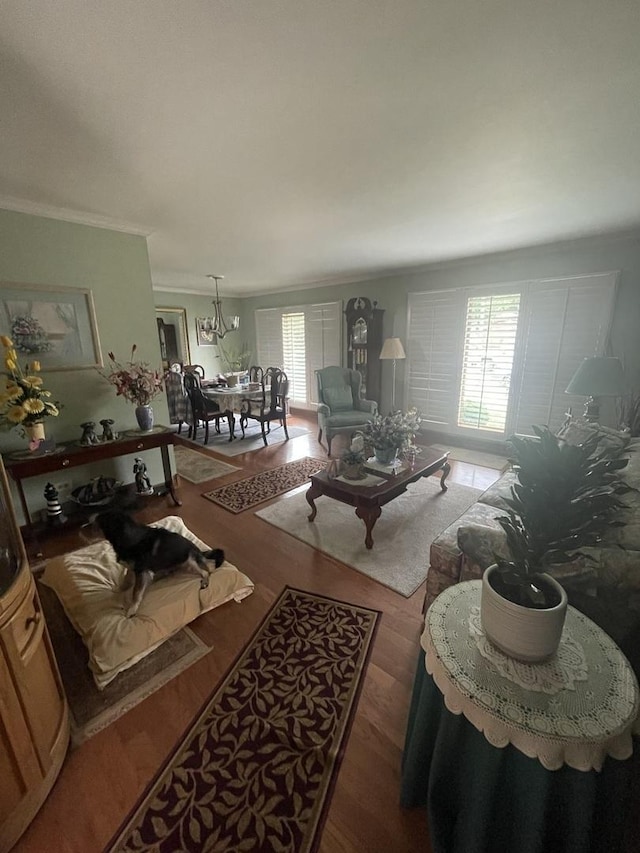 10752 S S Ave E, Chicago, IL 60617 - living room with ornamental molding, wood finished floors, and a chandelier