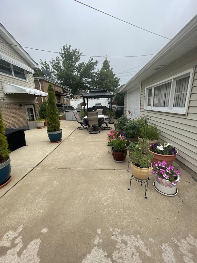 10752 S S Ave E, Chicago, IL 60617 - view of patio / terrace featuring a gazebo and outdoor dining space