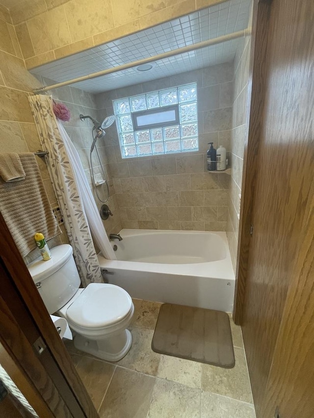 10752 S S Ave E, Chicago, IL 60617 - bathroom featuring shower / bathtub combination with curtain and stone tile flooring