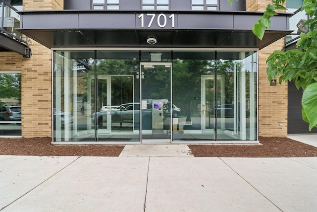 1701 W Webster Ave Unit 512, Chicago, IL 60614 - view of exterior entry with brick siding and a security system