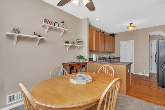 5011 Elmira Ct, Plainfield, IL 60586 - carpeted dining area with a sink and a ceiling fan