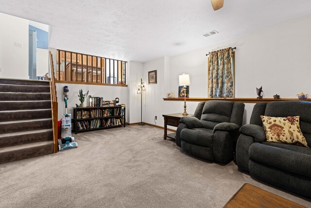 5555 Raspberry Trl, Rockford, IL 61114 - living area featuring carpet flooring, stairs, and a textured ceiling