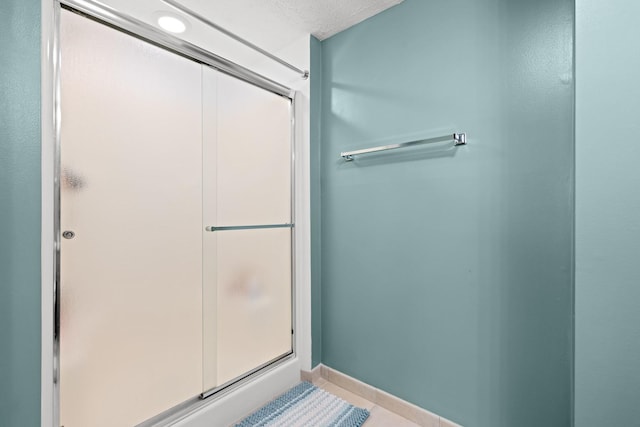 5555 Raspberry Trl, Rockford, IL 61114 - bathroom featuring a stall shower and tile patterned flooring