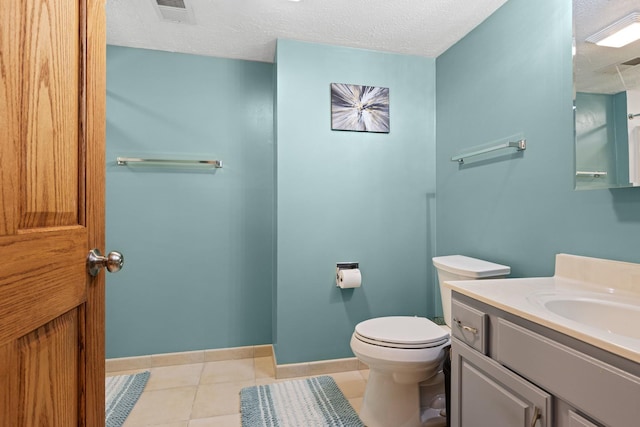 5555 Raspberry Trl, Rockford, IL 61114 - bathroom with vanity, a textured ceiling, and tile patterned flooring