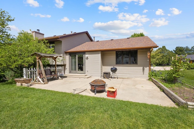 5555 Raspberry Trl, Rockford, IL 61114 - back of property featuring an outdoor fire pit, a patio area, and roof with shingles