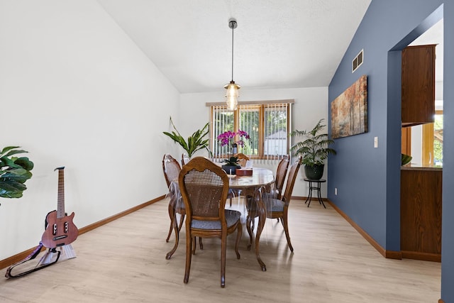 5555 Raspberry Trl, Rockford, IL 61114 - dining space featuring lofted ceiling and light wood-style flooring