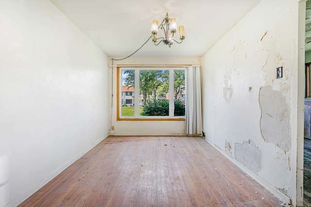 17 Michael Rd, Park Forest, IL 60466 - empty room with a chandelier and hardwood / wood-style floors