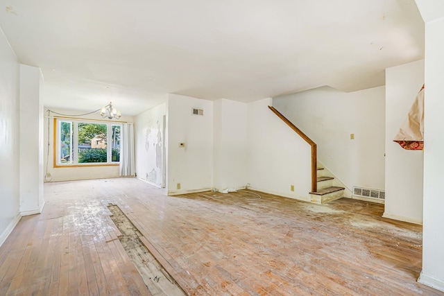17 Michael Rd, Park Forest, IL 60466 - unfurnished living room featuring hardwood / wood-style floors, stairway, and a chandelier