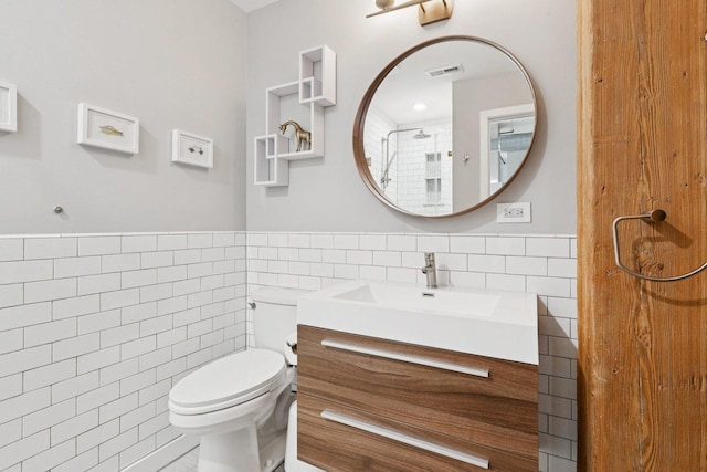 2511 W Moffat St Unit 501, Chicago, IL 60647 - bathroom with tile walls, vanity, and wainscoting