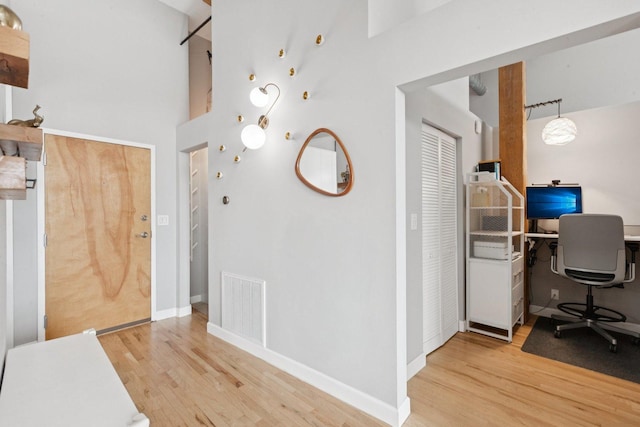 2511 W Moffat St Unit 501, Chicago, IL 60647 - office area featuring wood finished floors and a towering ceiling