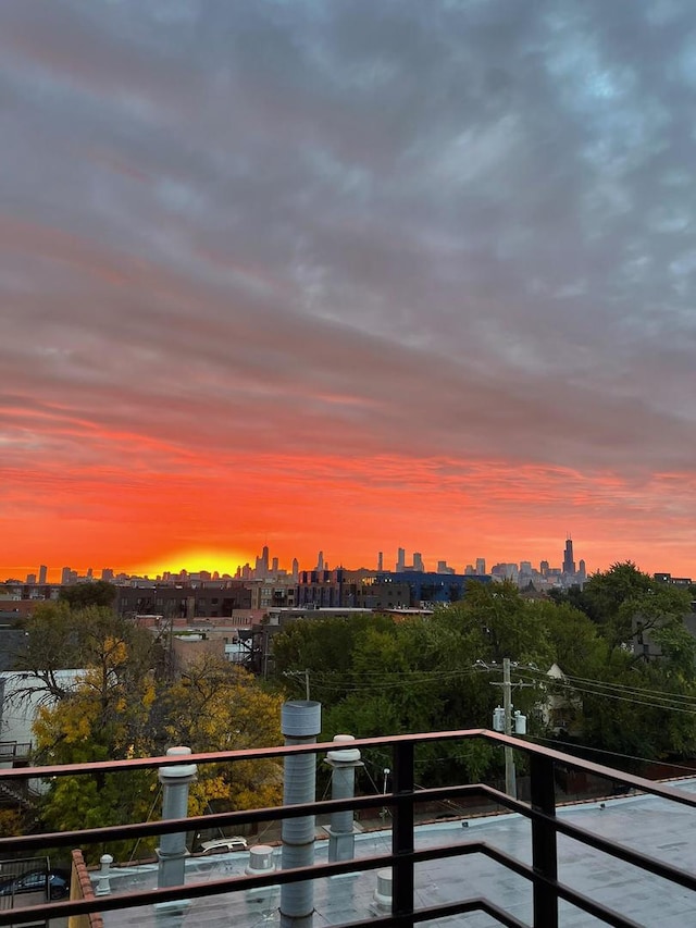 2511 W Moffat St Unit 501, Chicago, IL 60647 - balcony at dusk with a skyline view