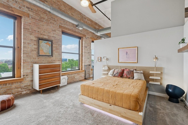 2511 W Moffat St Unit 501, Chicago, IL 60647 - carpeted bedroom featuring brick wall and a towering ceiling