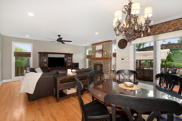 601 W Crockett Ave, Elmhurst, IL 60126 - dining space featuring healthy amount of natural light, a brick fireplace, light wood finished floors, and recessed lighting