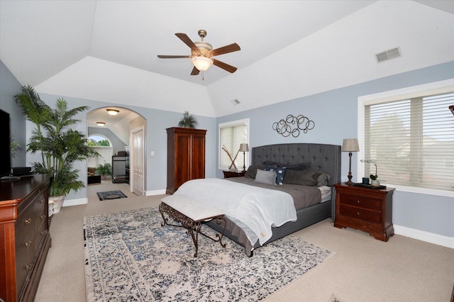 601 W Crockett Ave, Elmhurst, IL 60126 - bedroom featuring vaulted ceiling, light carpet, arched walkways, and a ceiling fan