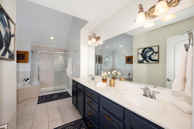 601 W Crockett Ave, Elmhurst, IL 60126 - bathroom featuring tile patterned flooring, double vanity, a stall shower, a garden tub, and recessed lighting