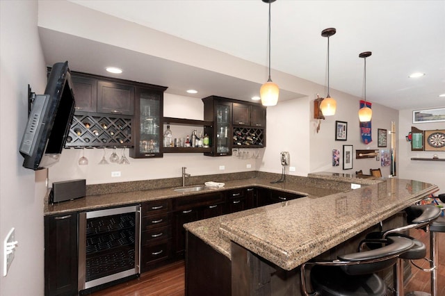 601 W Crockett Ave, Elmhurst, IL 60126 - indoor wet bar with wine cooler, dark wood-style floors, pendant lighting, and recessed lighting