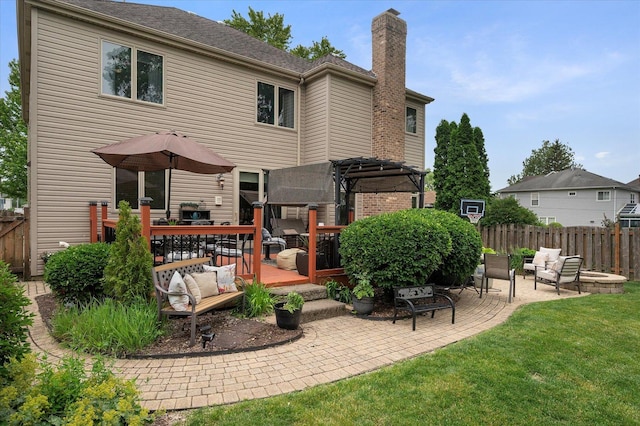 601 W Crockett Ave, Elmhurst, IL 60126 - back of property featuring a chimney, an outdoor hangout area, and a patio