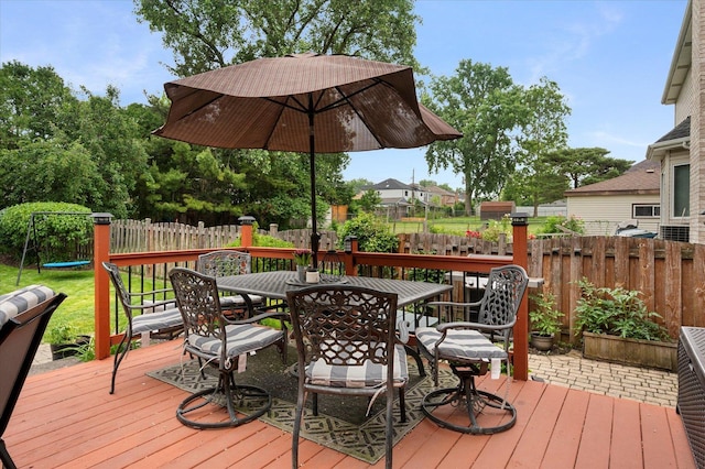 601 W Crockett Ave, Elmhurst, IL 60126 - wooden deck featuring outdoor dining space and a fenced backyard