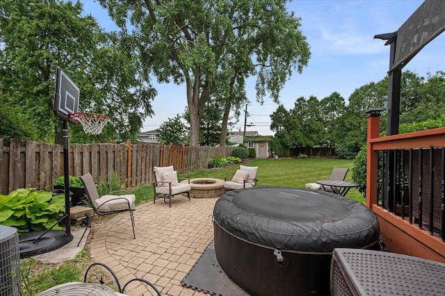 601 W Crockett Ave, Elmhurst, IL 60126 - fenced backyard with a fire pit, a storage unit, and a patio area