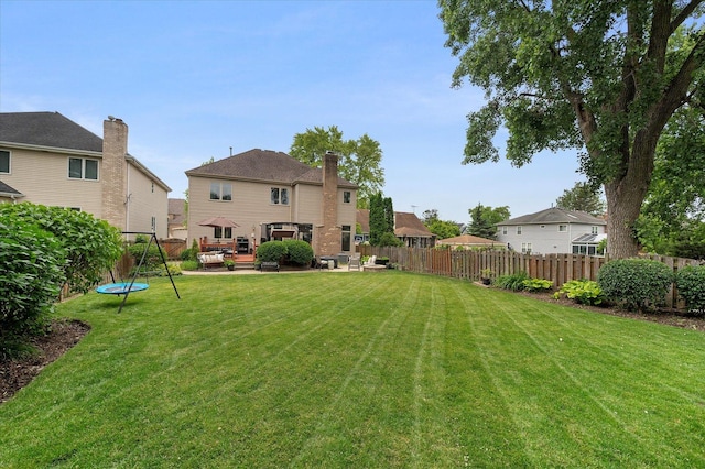 601 W Crockett Ave, Elmhurst, IL 60126 - view of yard with a trampoline, an outdoor hangout area, a deck, and a residential view