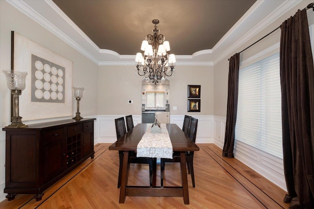 601 W Crockett Ave, Elmhurst, IL 60126 - dining space with a raised ceiling, light wood-type flooring, a chandelier, wainscoting, and a decorative wall