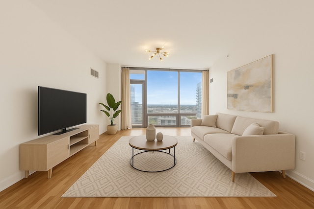 100 E 14th St Unit 2007, Chicago, IL 60605 - living room featuring expansive windows and light wood-style flooring
