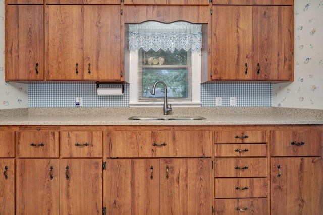 505 Douglas St, Morris, IL 60450 - kitchen featuring brown cabinetry, tasteful backsplash, and wallpapered walls