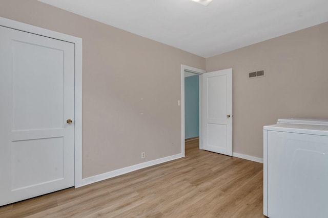 505 Douglas St, Morris, IL 60450 - unfurnished room featuring washer / dryer and light wood-style floors