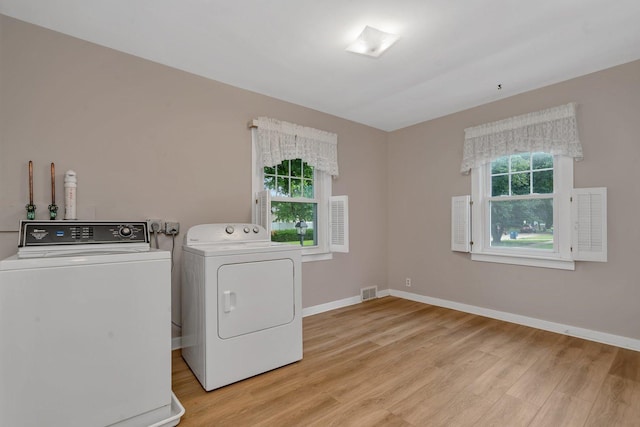 505 Douglas St, Morris, IL 60450 - laundry room with washing machine and clothes dryer and light wood-type flooring