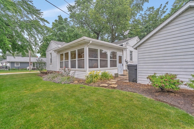 505 Douglas St, Morris, IL 60450 - rear view of property with a yard and a sunroom