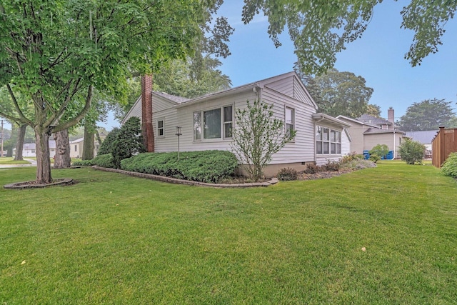 505 Douglas St, Morris, IL 60450 - view of front of house with a front yard and a chimney