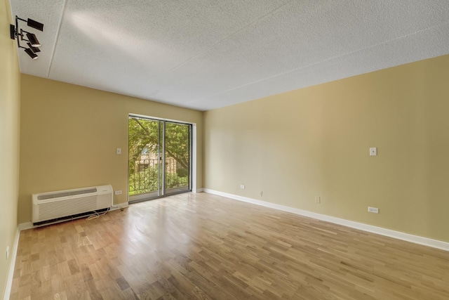 5550 Astor Ln Unit 214, Rolling Meadows, IL 60008 - spare room with a textured ceiling and wood finished floors