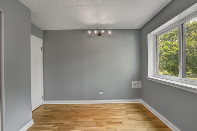 5550 Astor Ln Unit 214, Rolling Meadows, IL 60008 - empty room featuring light wood-style floors and baseboards