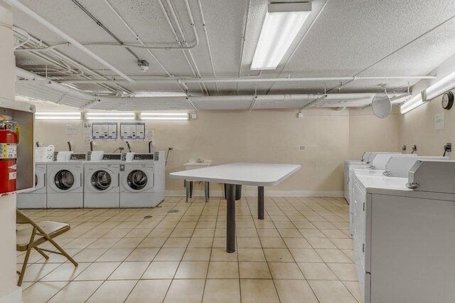 5550 Astor Ln Unit 214, Rolling Meadows, IL 60008 - community laundry room with independent washer and dryer and baseboards