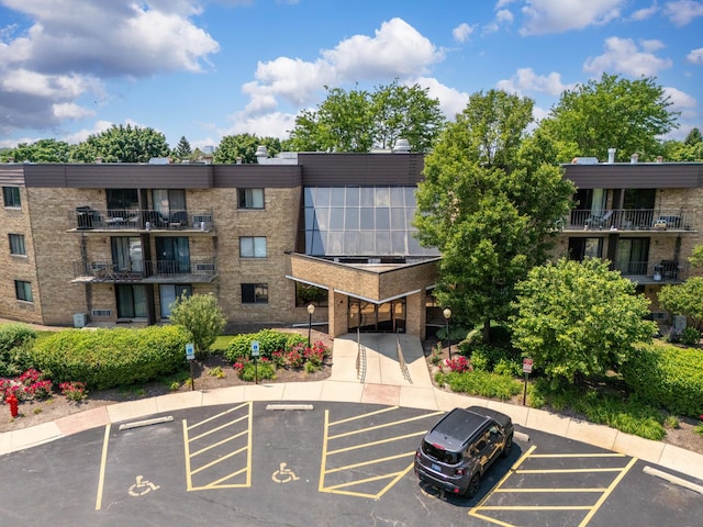 5550 Astor Ln Unit 214, Rolling Meadows, IL 60008 - view of apartment building / complex with uncovered parking