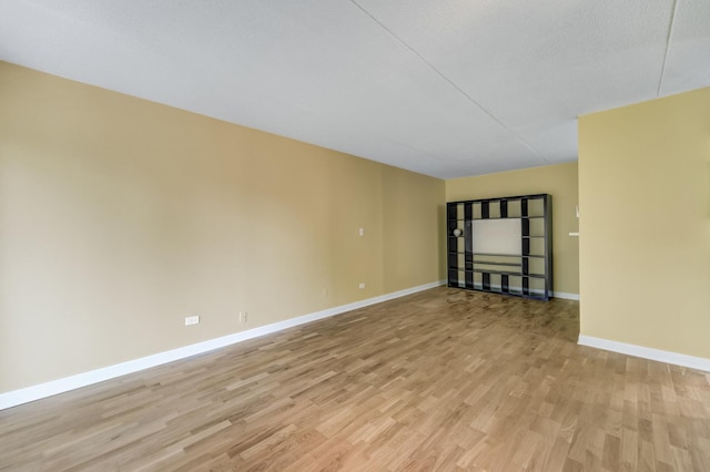 5550 Astor Ln Unit 214, Rolling Meadows, IL 60008 - empty room with light wood-style flooring and baseboards