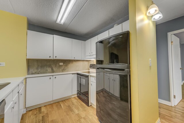 5550 Astor Ln Unit 214, Rolling Meadows, IL 60008 - kitchen featuring electric range, freestanding refrigerator, light countertops, light wood-type flooring, and under cabinet range hood