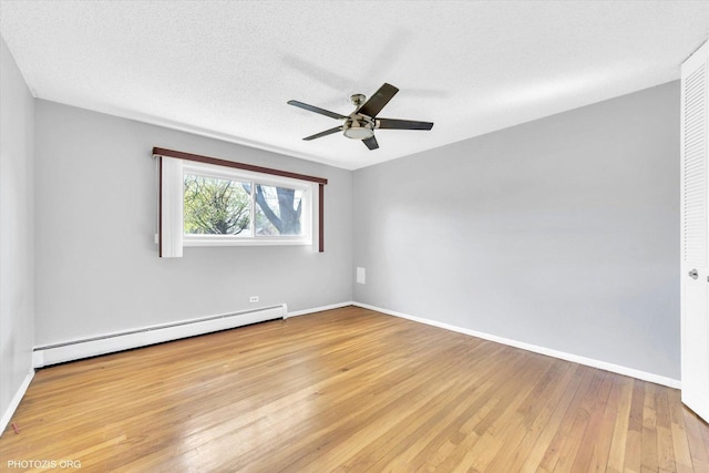 9205 Potter Rd Unit 1C, Des Plaines, IL 60016 - empty room with baseboard heating, light wood finished floors, and a ceiling fan