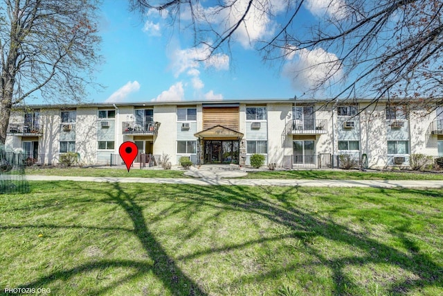 9205 Potter Rd Unit 1C, Des Plaines, IL 60016 - view of front of property featuring a front lawn and cooling unit