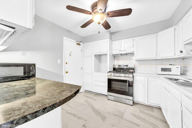 9205 Potter Rd Unit 1C, Des Plaines, IL 60016 - kitchen featuring stainless steel range with gas cooktop, white microwave, black microwave, under cabinet range hood, and white cabinets