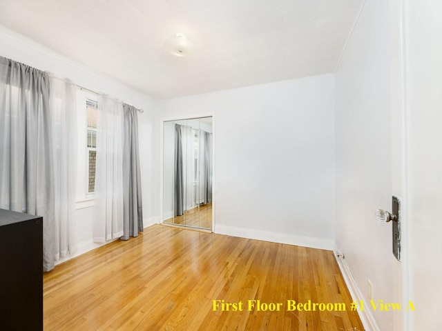 4130 N Oketo Ave, Norridge, IL 60706 - unfurnished room featuring baseboards and light wood-style flooring