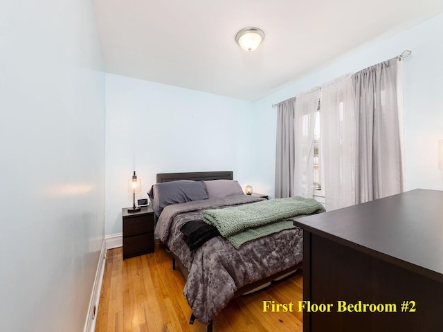4130 N Oketo Ave, Norridge, IL 60706 - bedroom featuring light wood-type flooring and baseboards