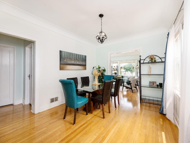 4130 N Oketo Ave, Norridge, IL 60706 - dining space with light wood-style floors and a chandelier