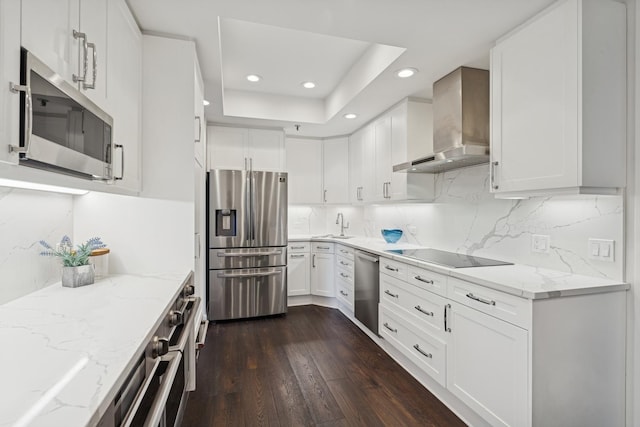 680 N Lake Shore Dr Unit 321, Chicago, IL 60611 - kitchen with stainless steel appliances, wall chimney range hood, recessed lighting, dark wood finished floors, and light stone countertops