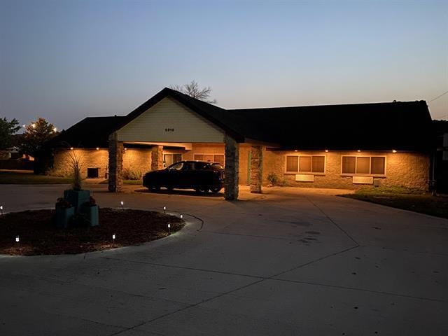 5918 Park Ridge Rd, Loves Park, IL 61111 - single story home with curved driveway and stone siding