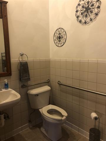 5918 Park Ridge Rd, Loves Park, IL 61111 - bathroom with tile walls, tile patterned flooring, and a wainscoted wall