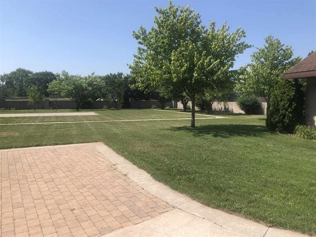5918 Park Ridge Rd, Loves Park, IL 61111 - view of grassy yard with a patio area