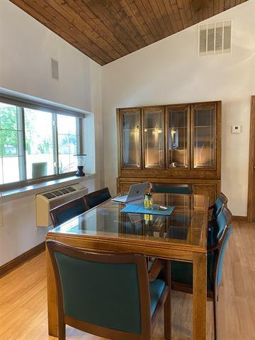 5918 Park Ridge Rd, Loves Park, IL 61111 - bar with wood ceiling, vaulted ceiling, and light wood-style flooring